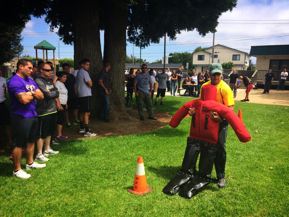 Participant engaged in an activity outside with a dummy